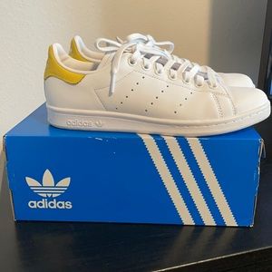 White and yellow Stan Smiths